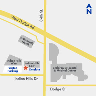 map showing check in location at north side of Indian Hills East building and visitor parking on north side of Indian Hills West building - both of these locations are on the south side of Indian Hills Drive